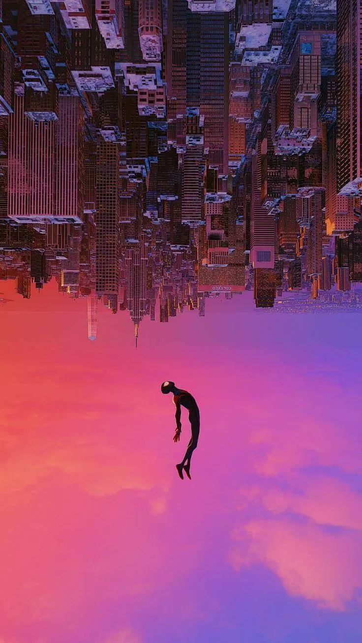 Upside down city with a person falling through the sunset