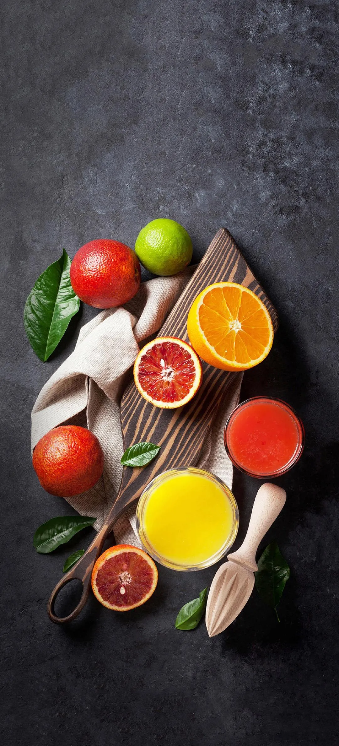 Vibrant Assortment of Fresh Fruits on Black Stone Wallpaper