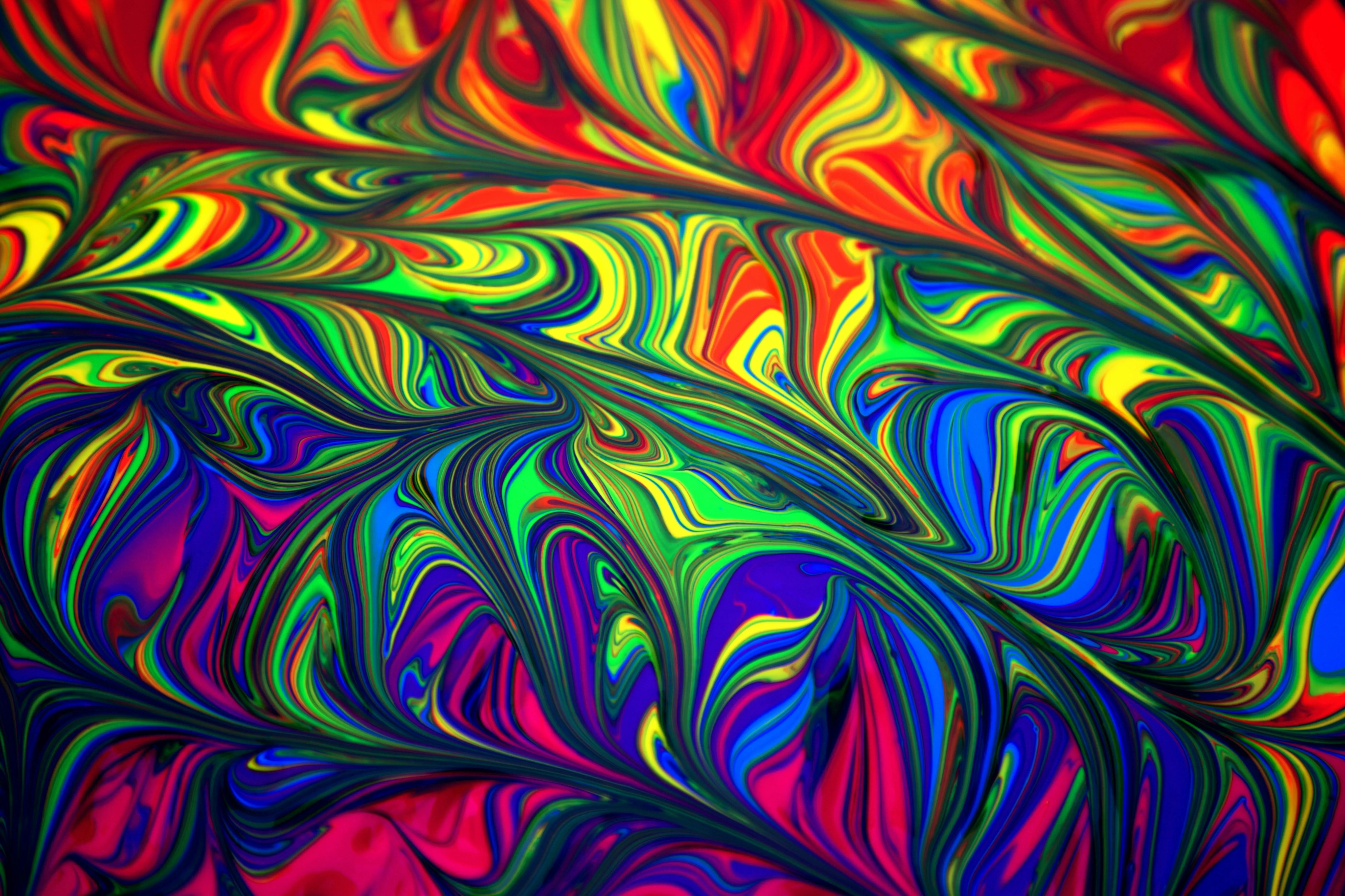 Vibrant colourful swirl pattern with dynamic flowing shapes