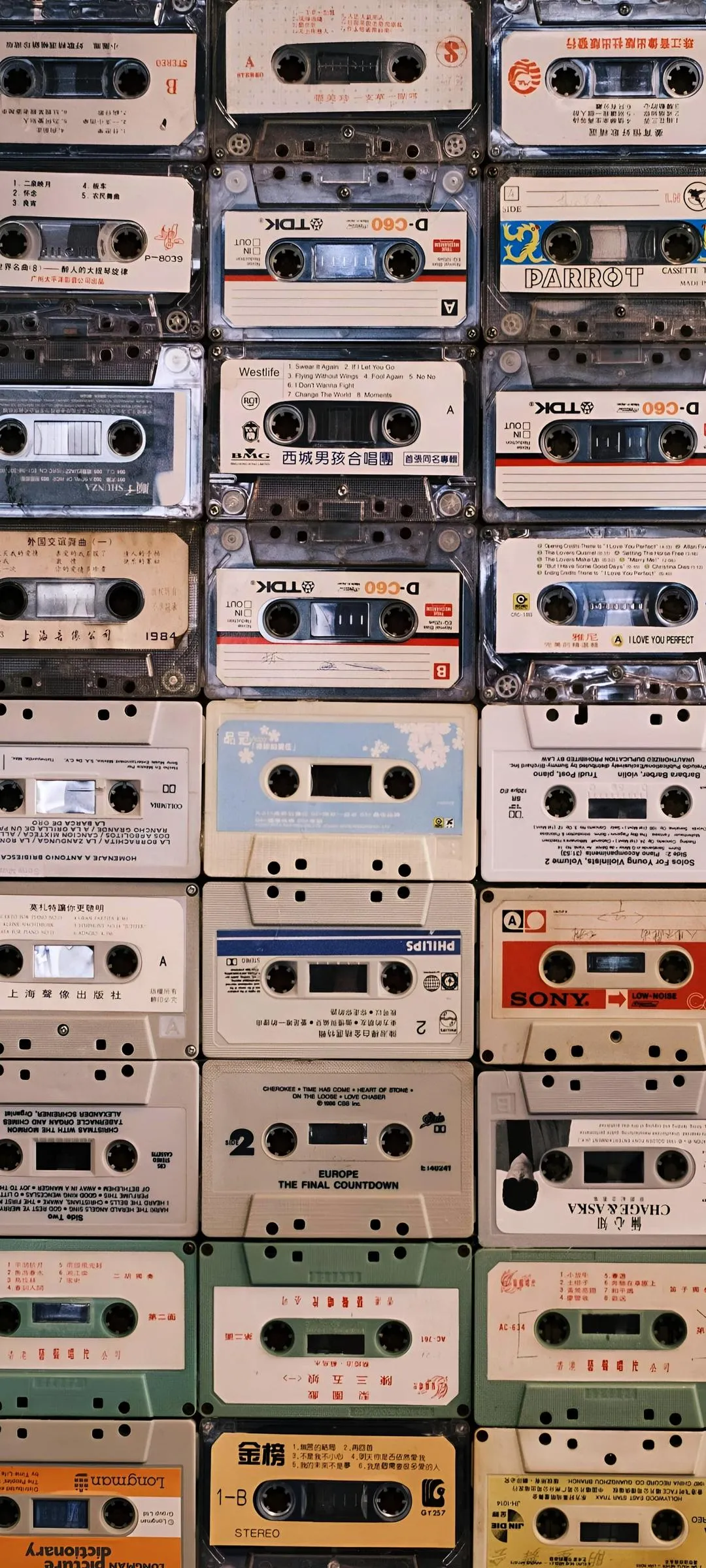 Vintage Cassette Tape Wall Art with Warm Tones Wallpaper