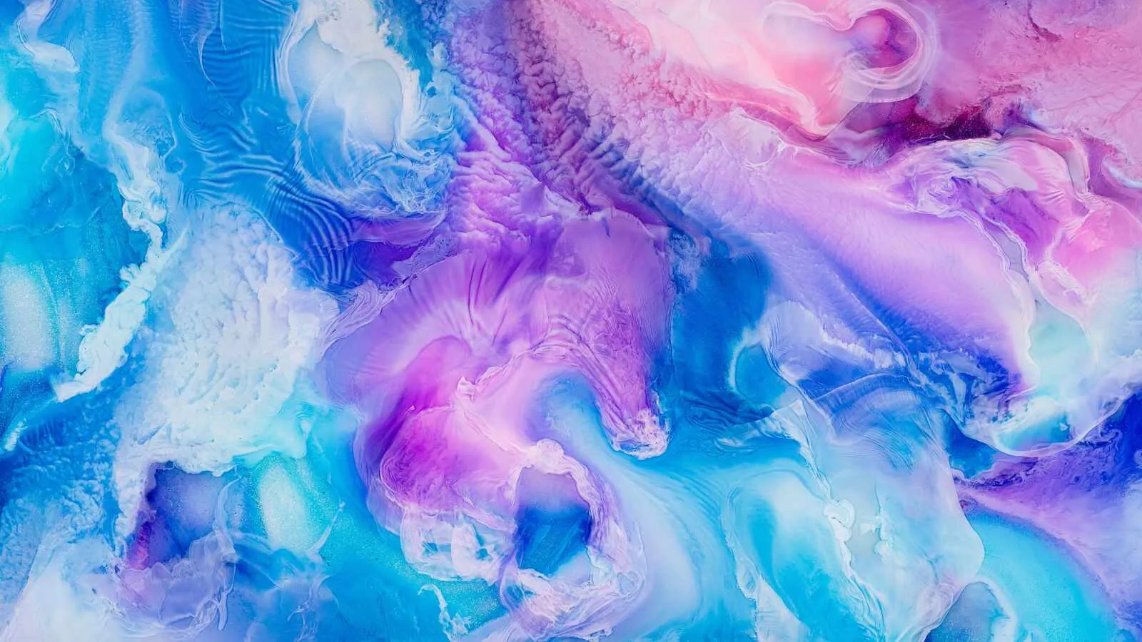 Vivid colourful fluid art with blue purple and pink swirls