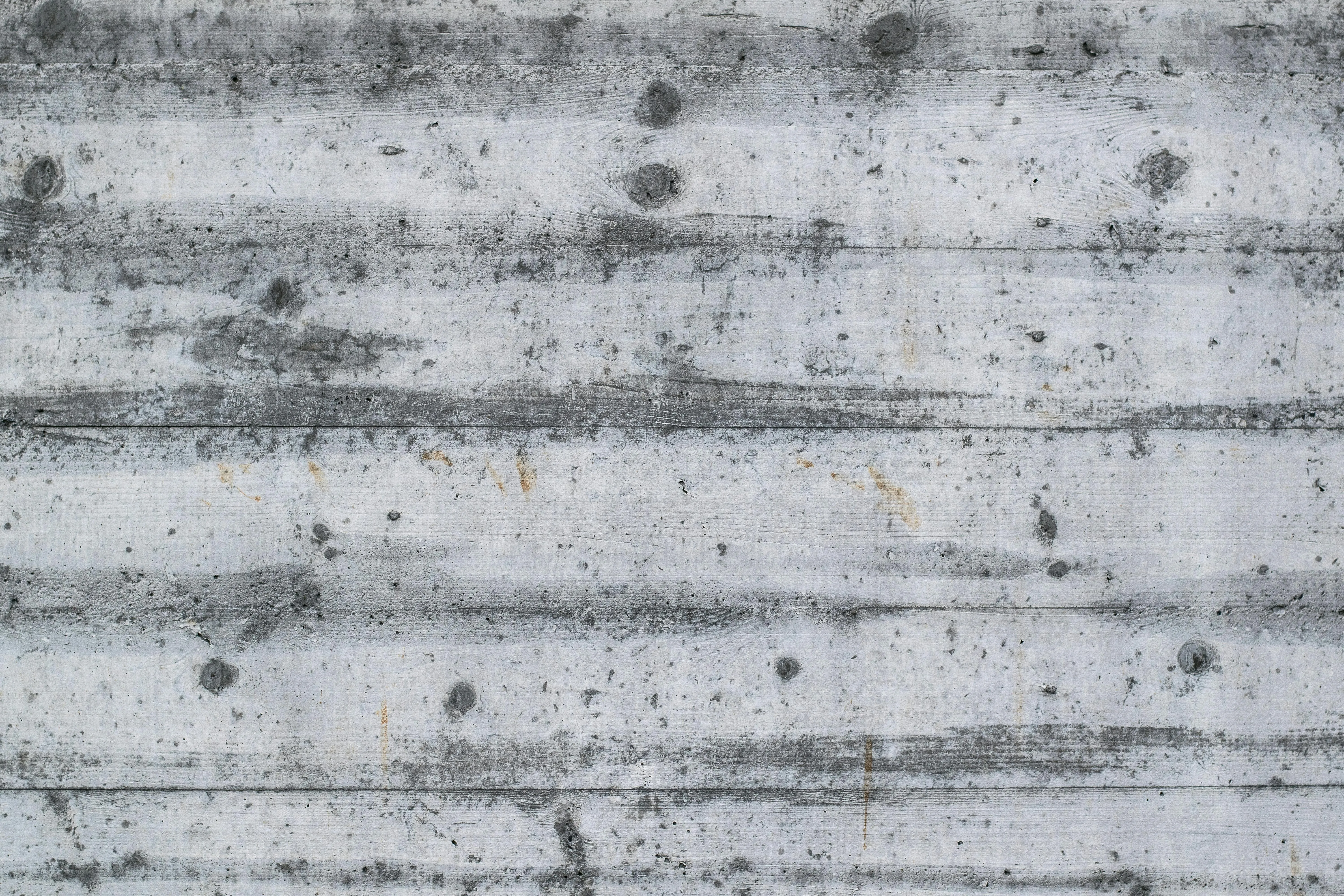 Weathered concrete wall with rough texture and stains image