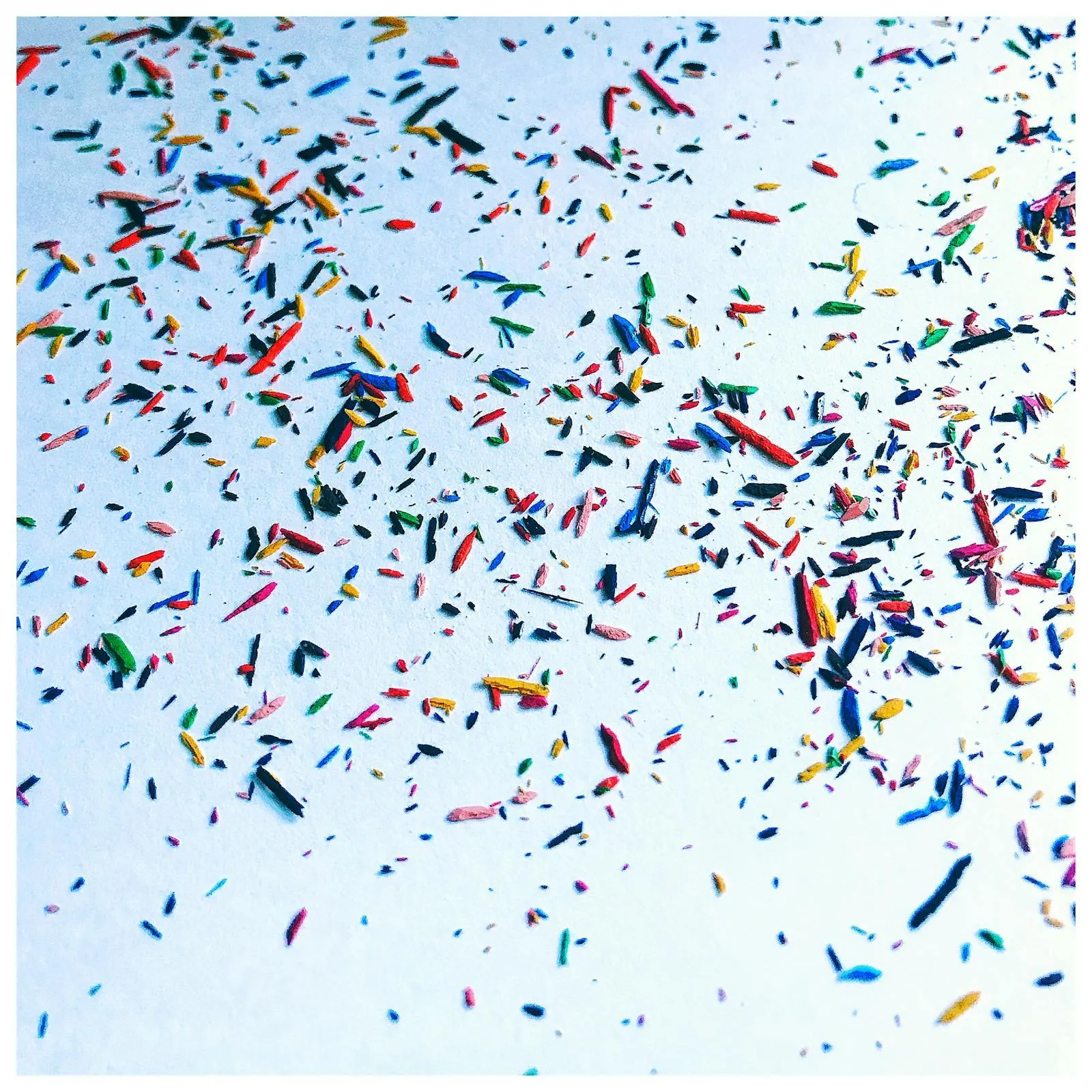 White background with vibrant confetti falling in the air