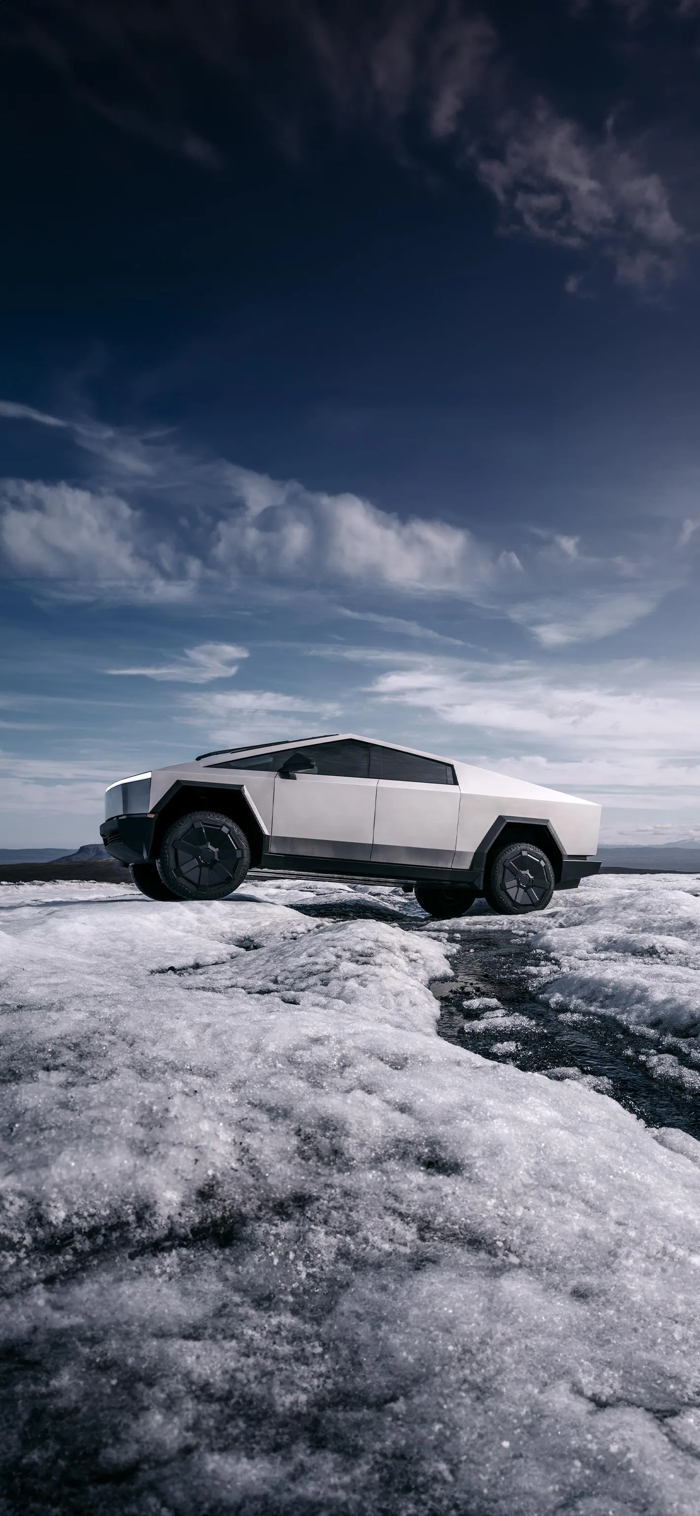 White Car Driving on Icy Road Surrounded by Snow Wallpaper