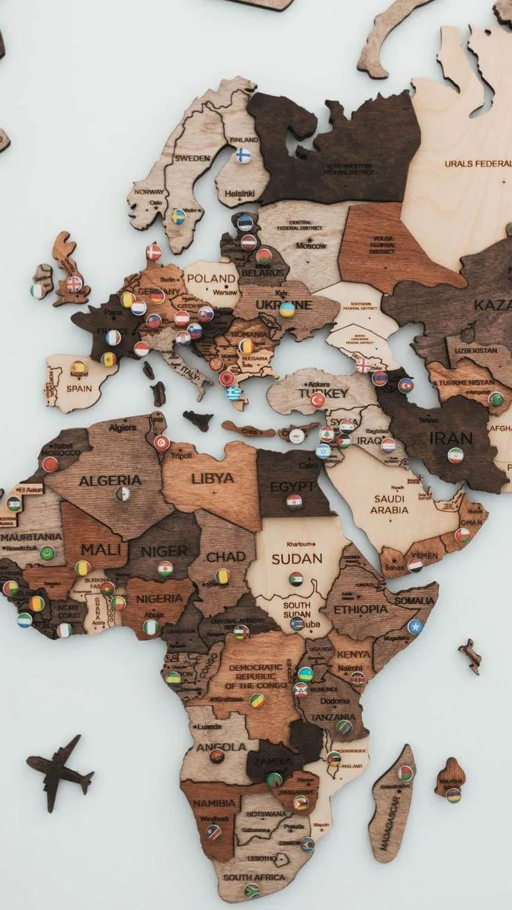 World map wooden design with an airplane flying Wallpaper