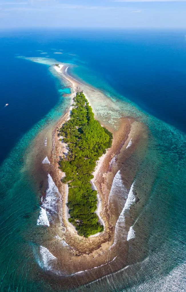 Aerial View of Tropical Island Surrounded by Clear Ocean