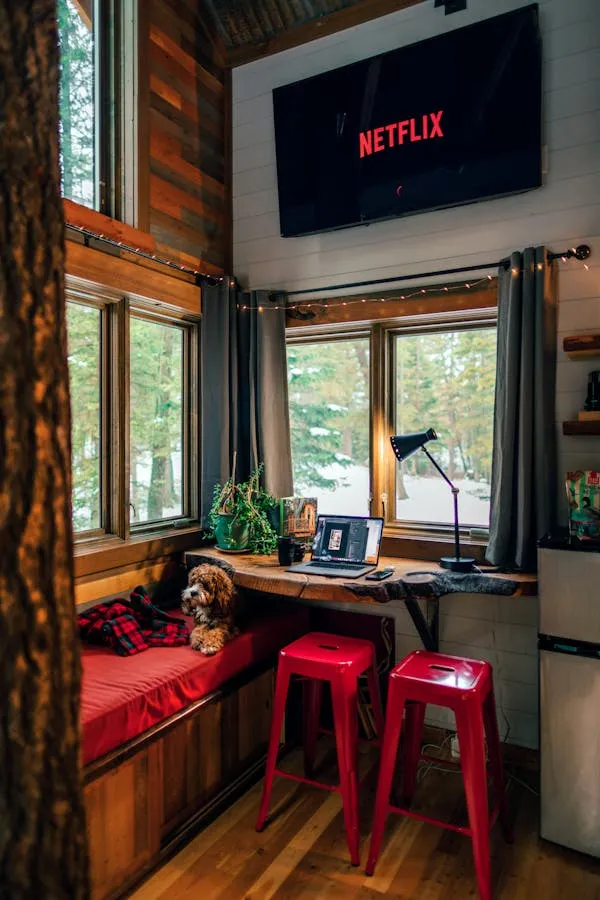Cozy Cabin with Dog and Netflix on the Tv Screen Wallpaper