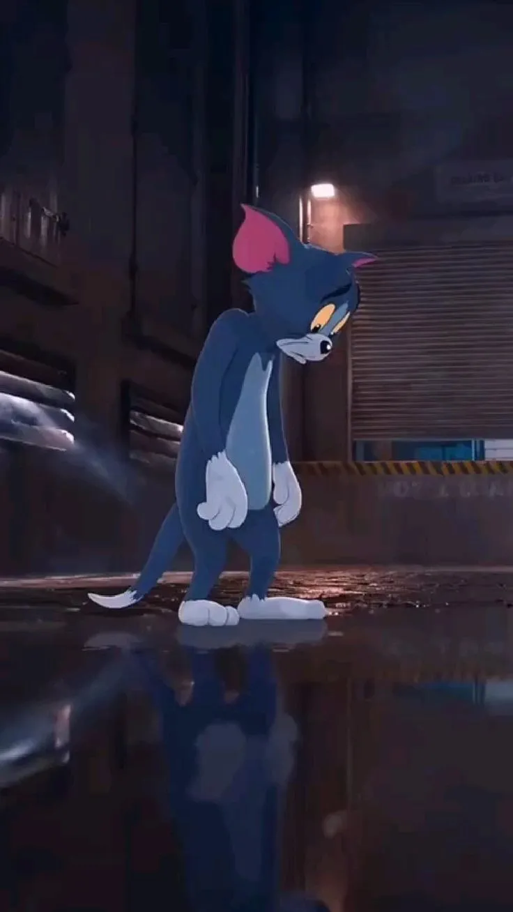 Dark scene with Tom standing alone under a streetlight