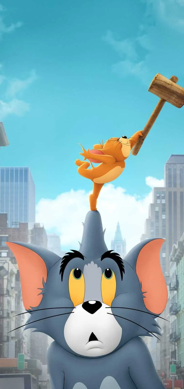 Jerry balances on Toms head while holding a big mallet