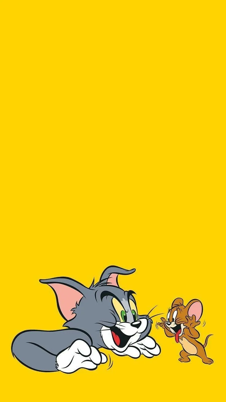 Tom and Jerry Playfully Fighting on Yellow Background