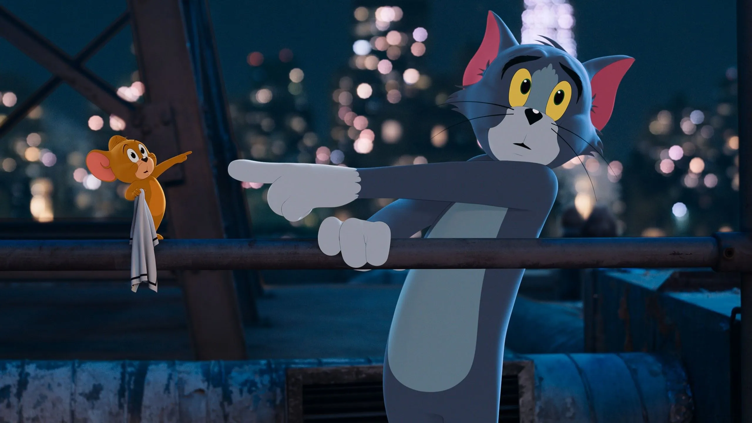 Tom and Jerry Sitting in a Movie Theater Watching a Show