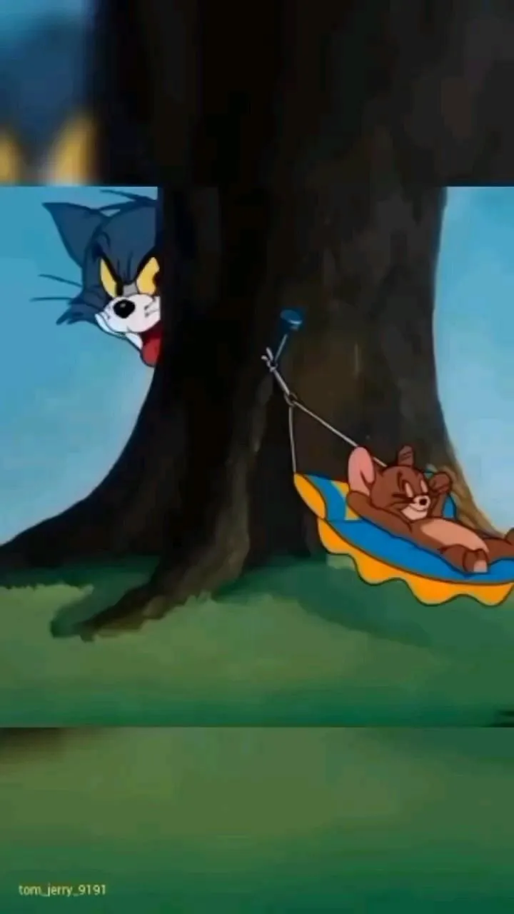 Tom and Jerry watching something at the door wallpaper