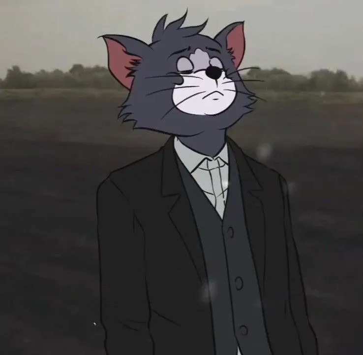 Tom in a suit looking serious in a movie style wallpaper