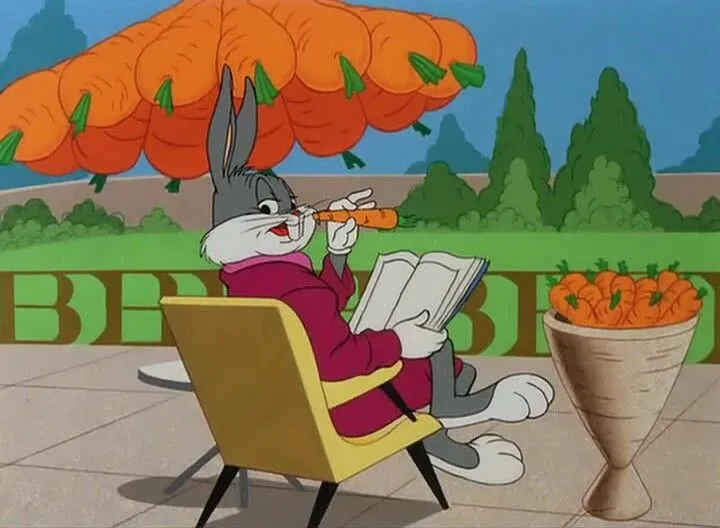 Tom relaxing under umbrella while Jerry hides behind chair