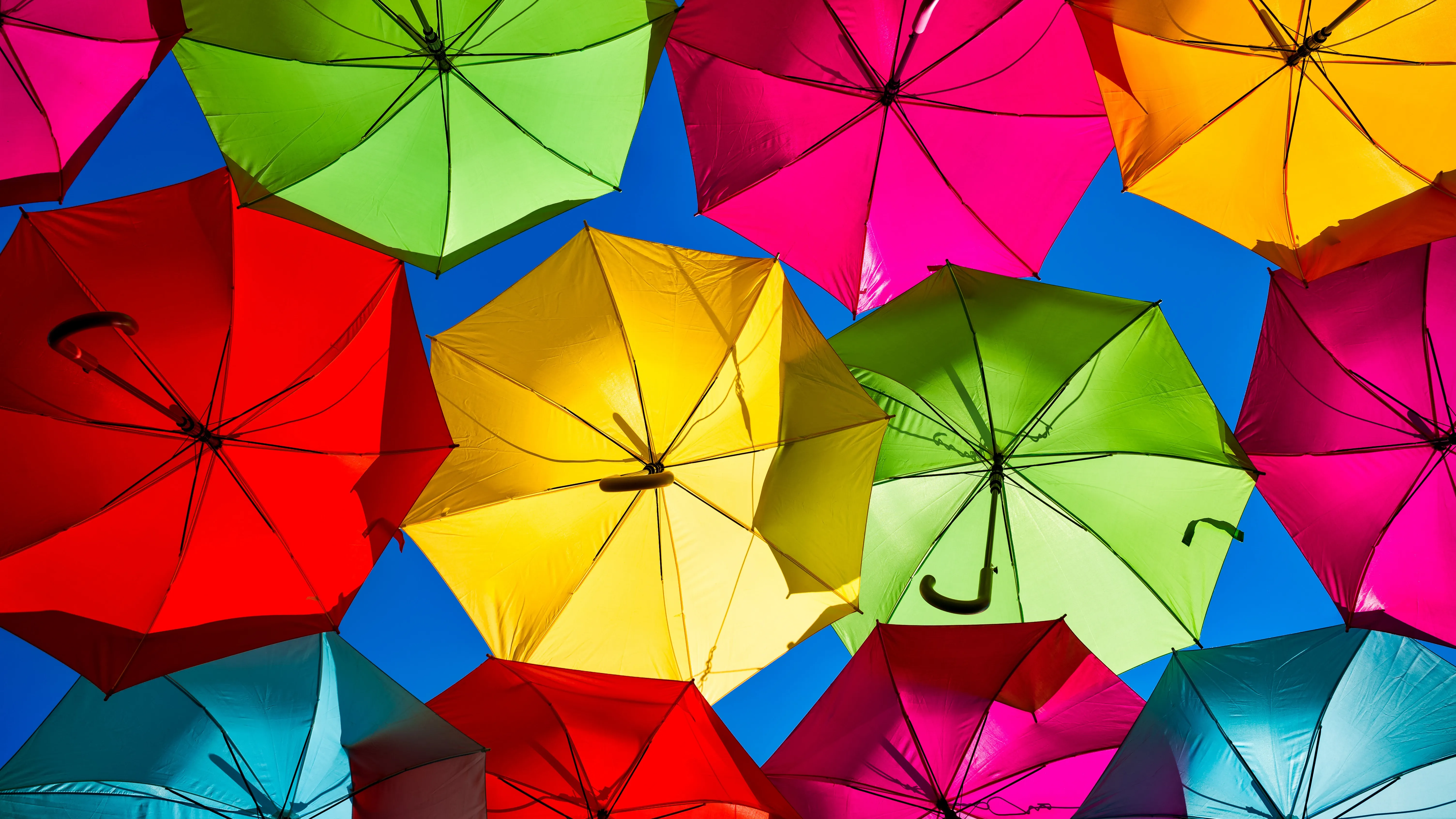 Clear Blue Sky Covered with Colourful Umbrellas Street Art