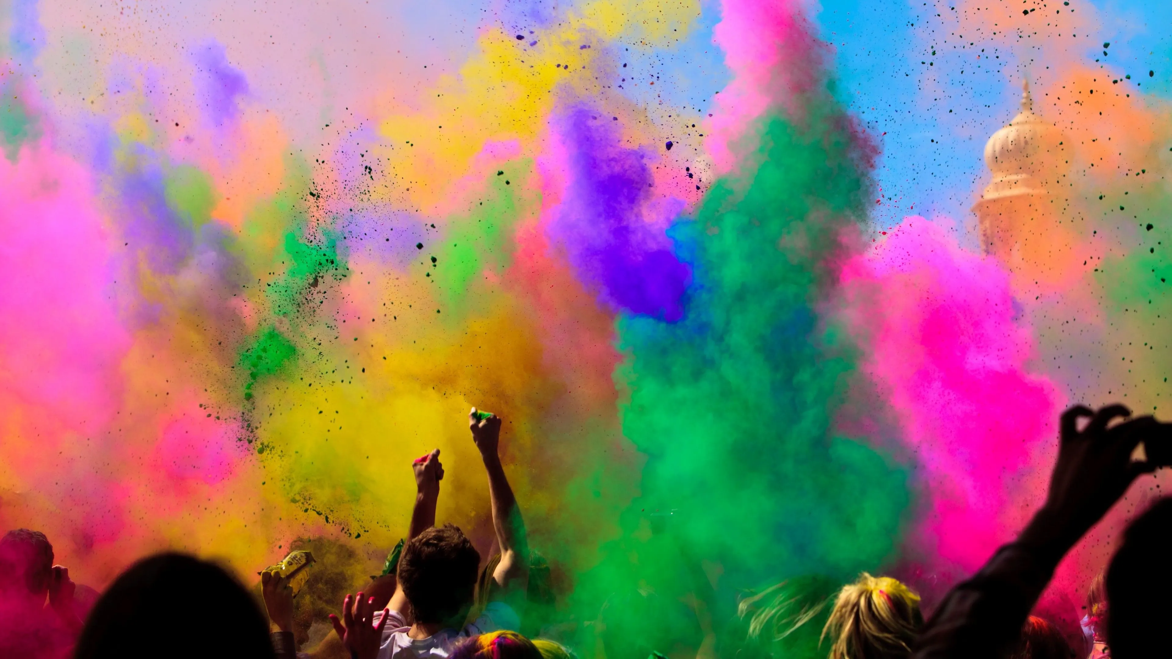 Crowd Celebrating a Colourful Festival with Holi Powder