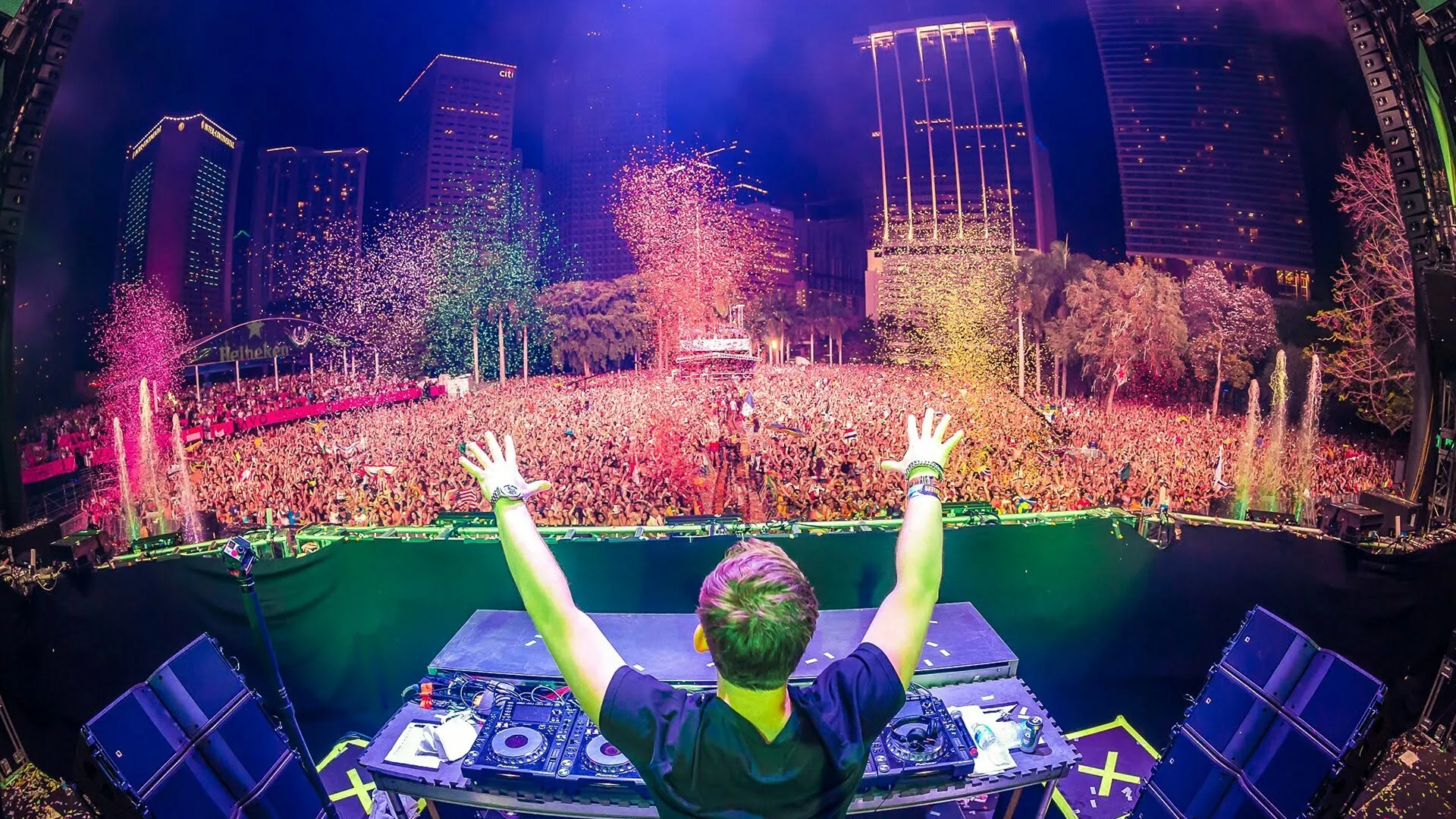 Energetic Dj Crowd Under City Lights and Fireworks Hd