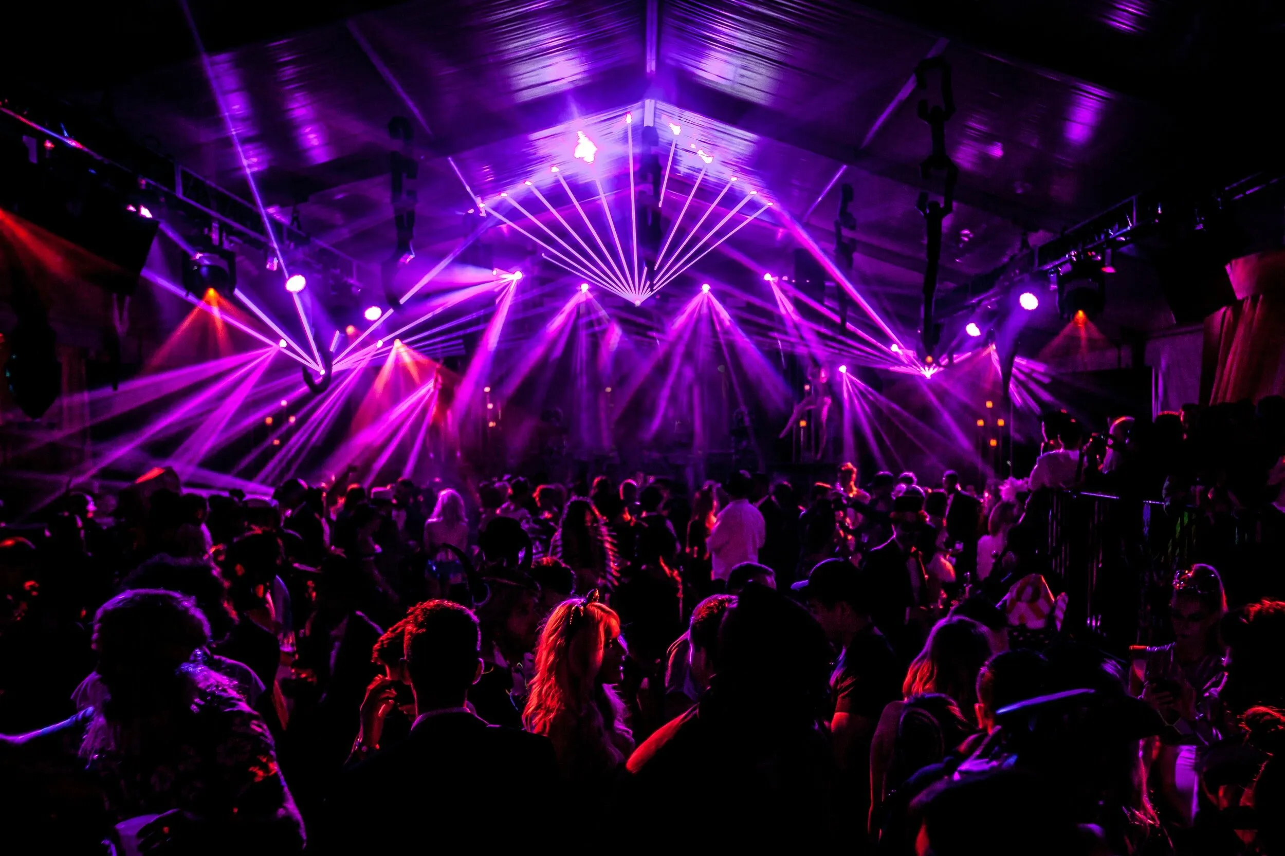 Event with Glowing Stage Lights and Shadow People Images
