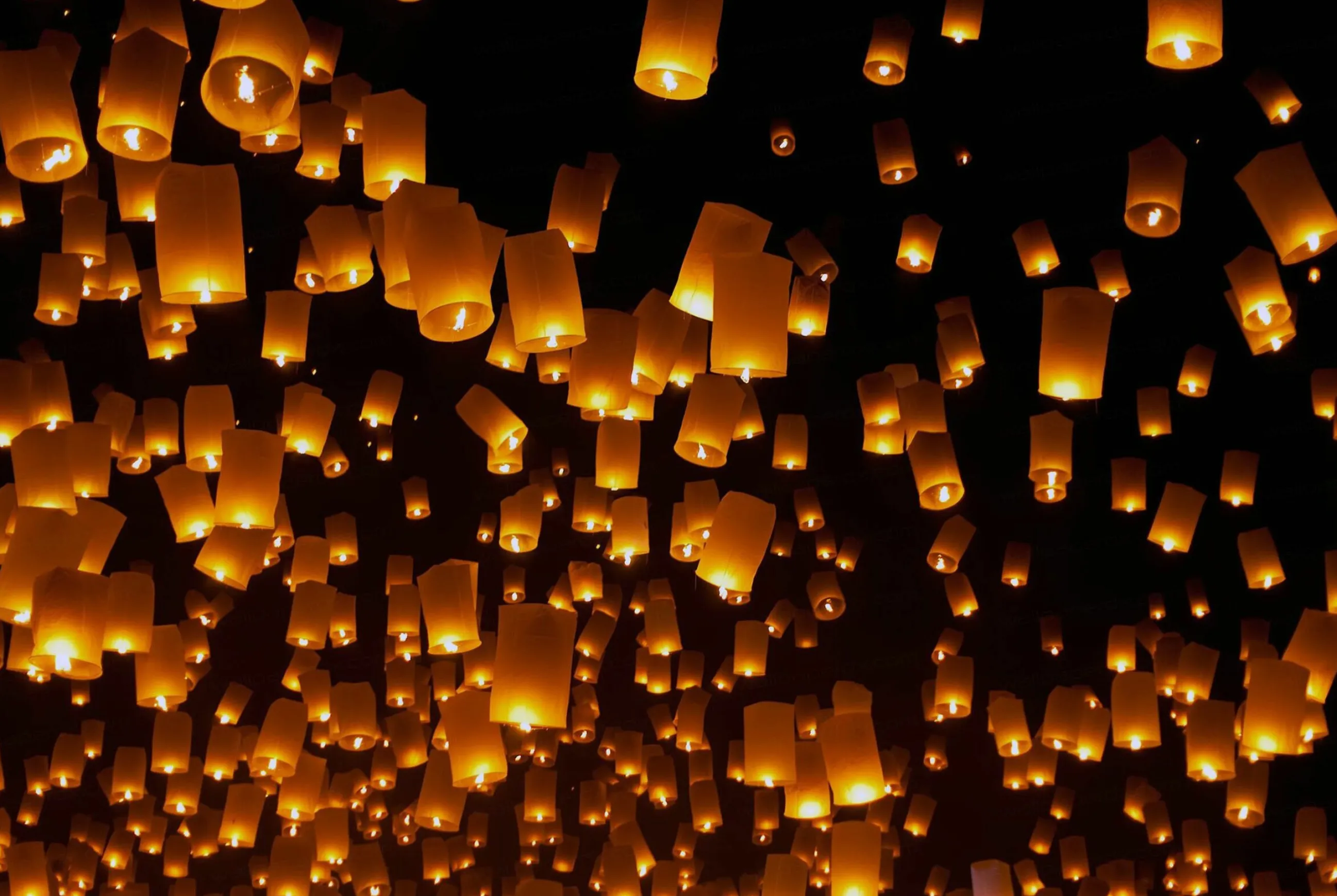 Lantern Festival Lights Flying in Night with a Golden Glow