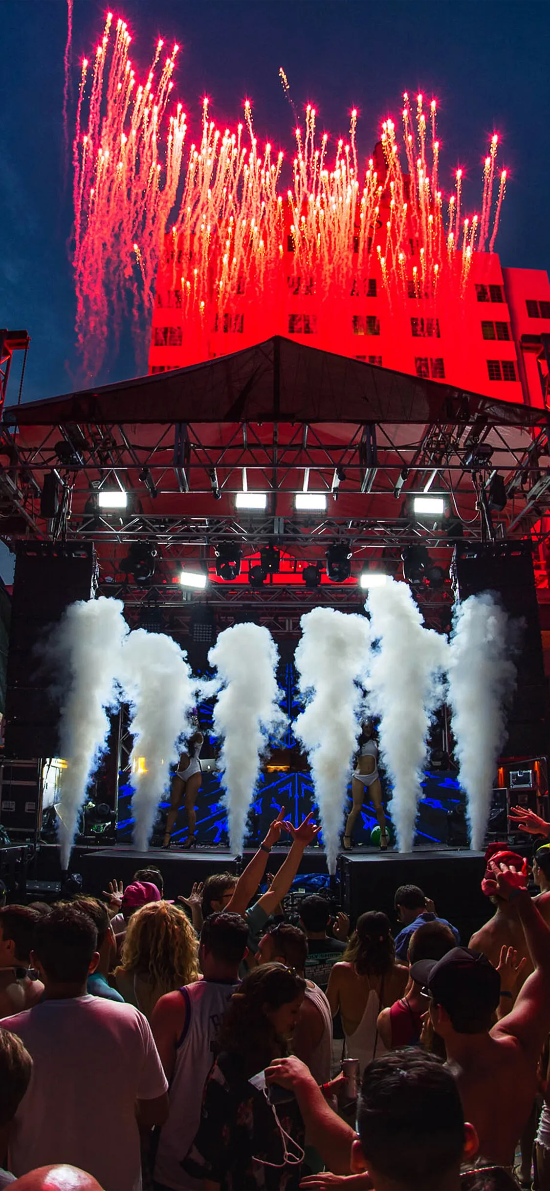 Night Show with Huge People Enjoying on Golden Lights