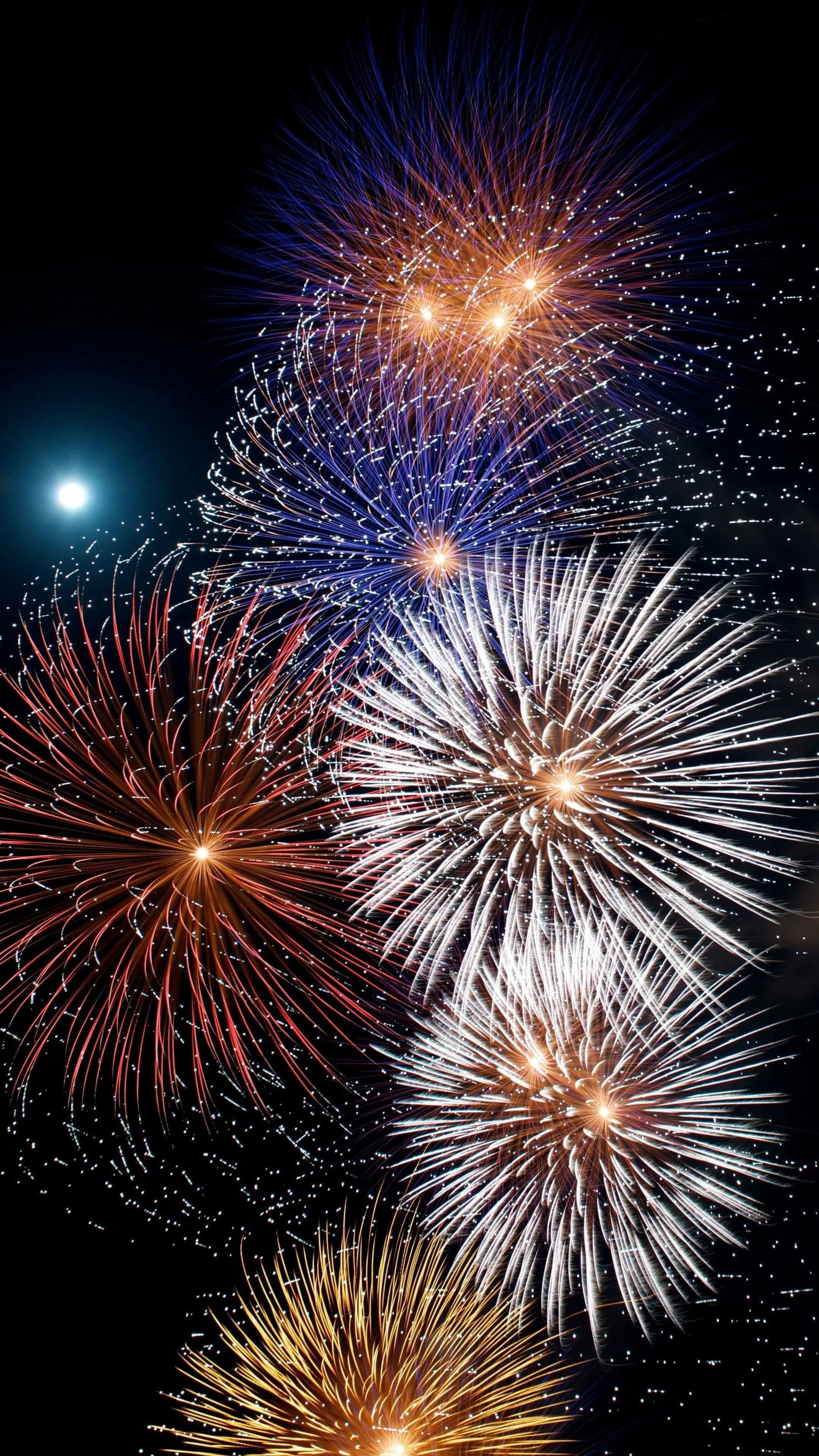 Stunning Red and White Fireworks with Reflection in Water