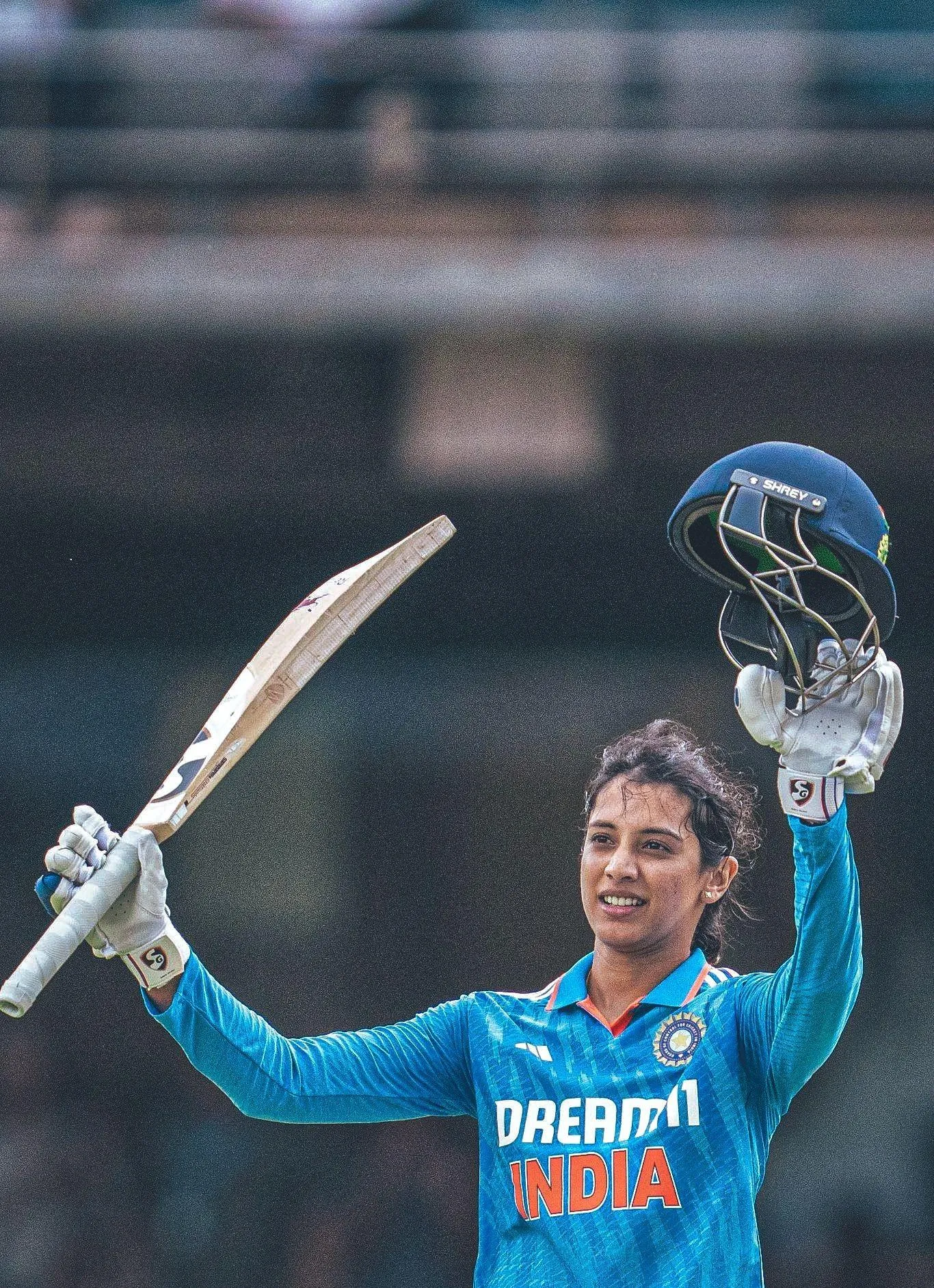 Celebrating a cricket milestone with raised bat wallpaper