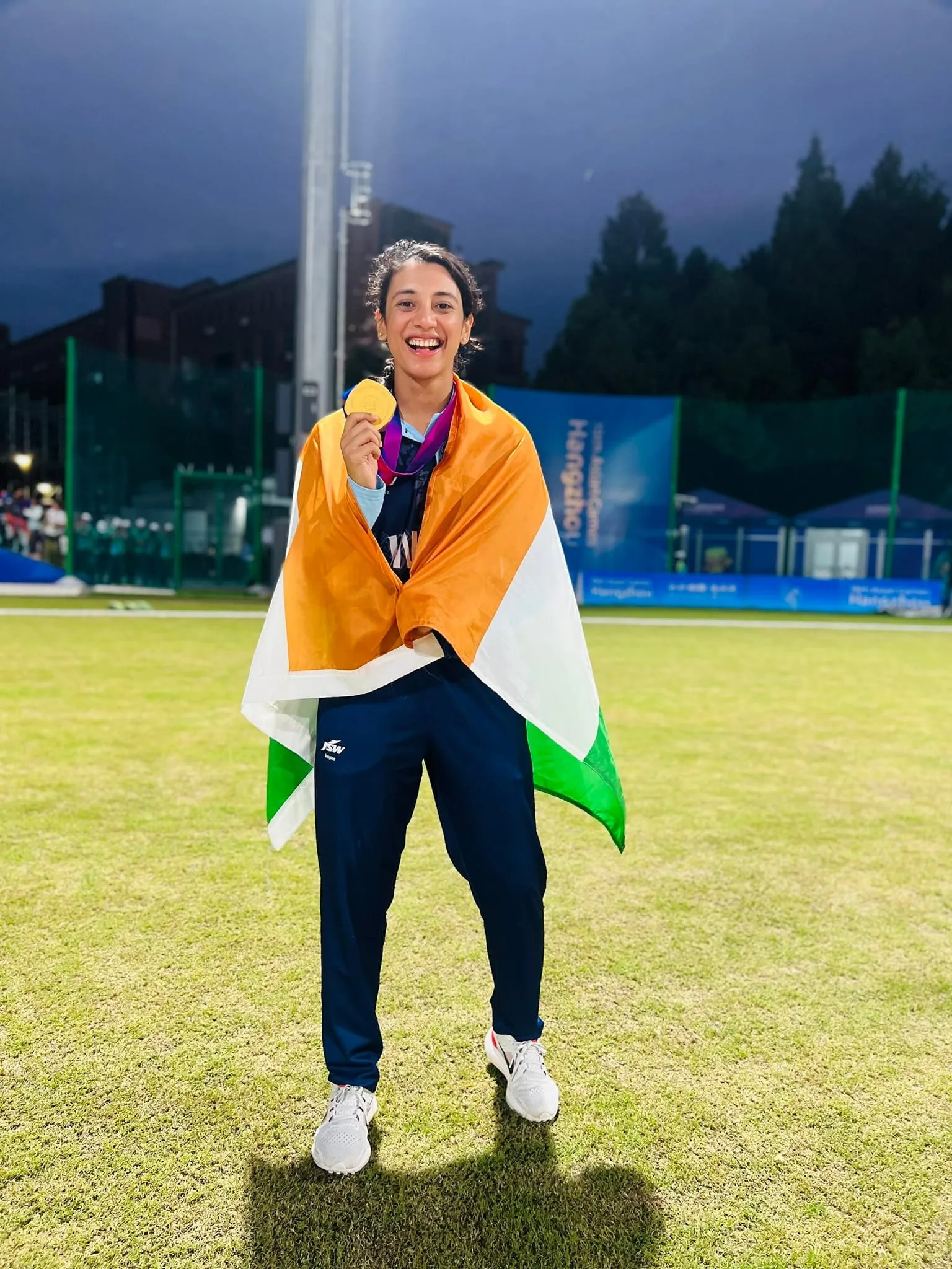 Indian athlete celebrates gold win wrapped in tricolor