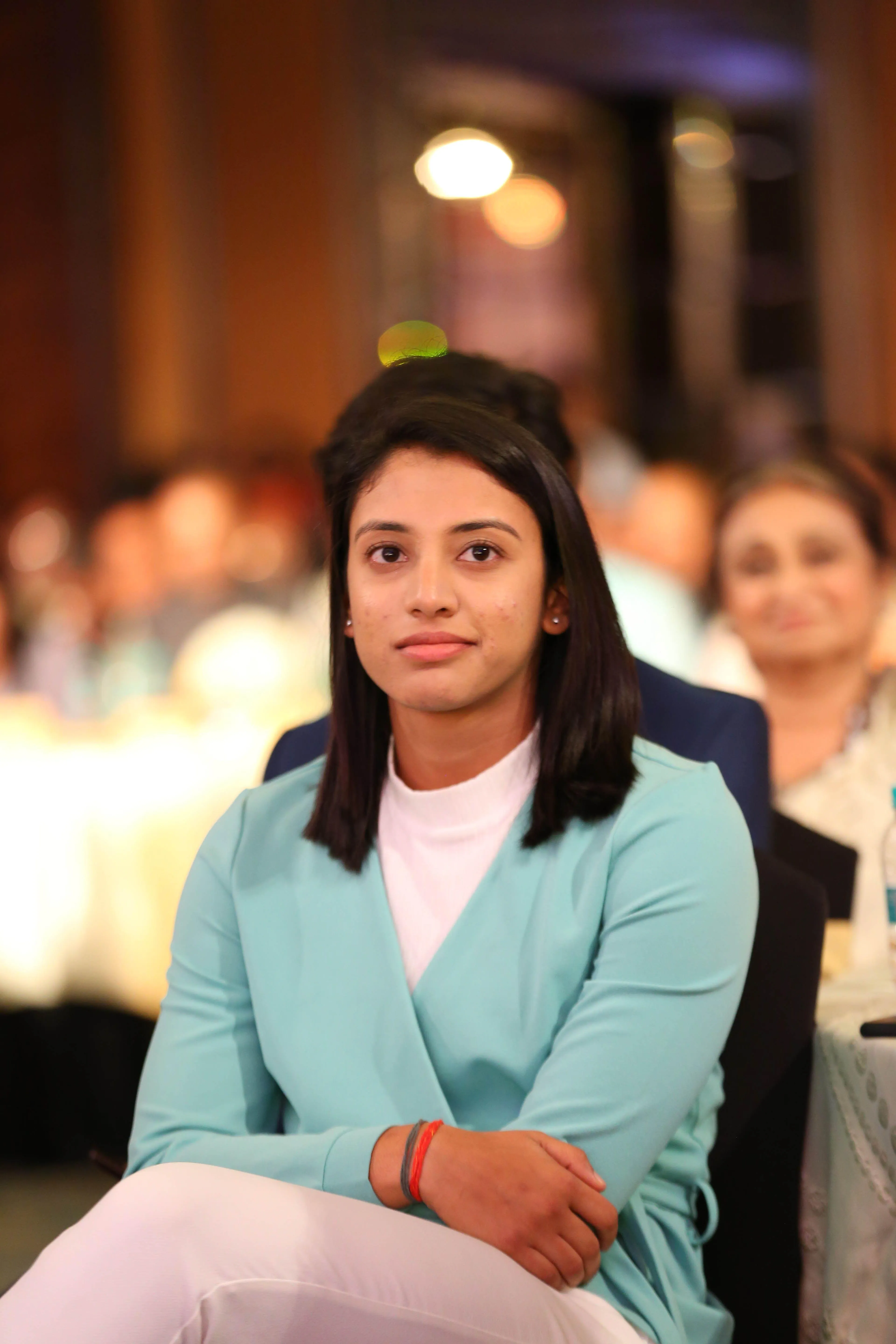Sitting calmly in a restaurant or event setting wallpaper