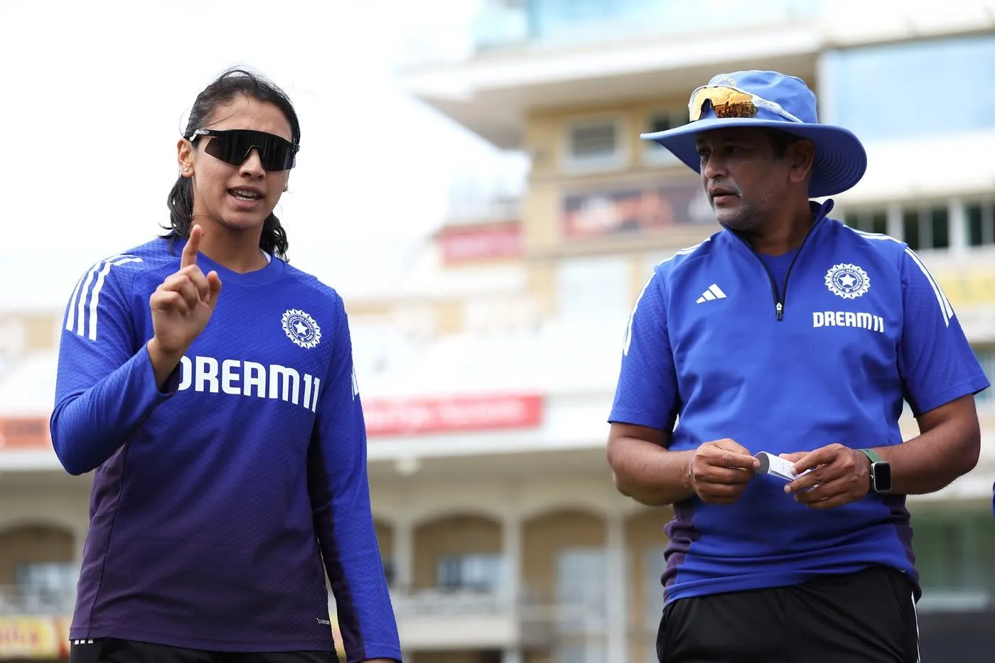 Smriti and Coach Discussing Strategy During Practice Session
