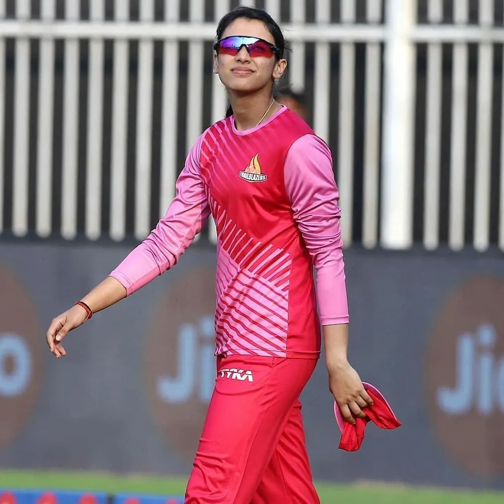 Smriti in Pink Uniform Showing Determination on the Field