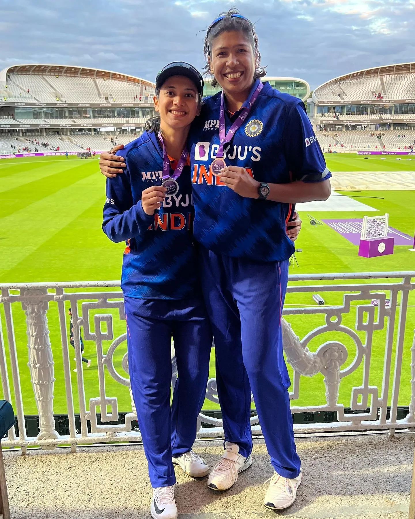 Smriti Mandhana and friend enjoying match from stadium seats