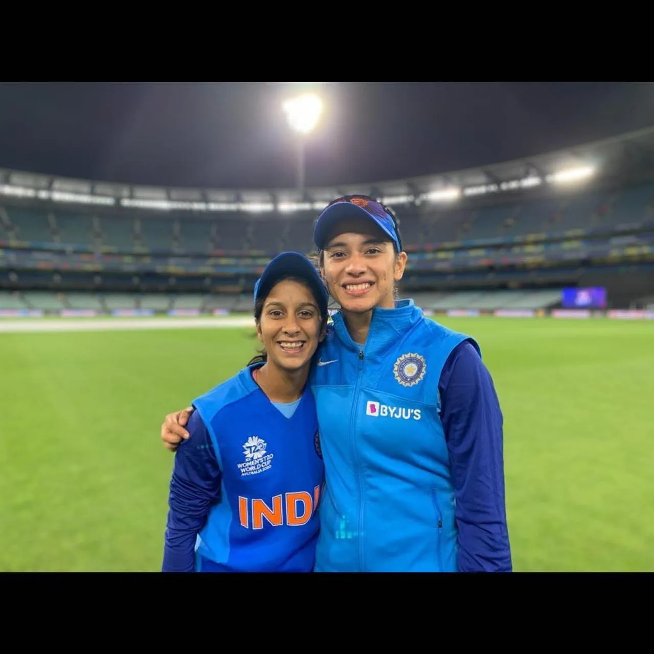 Smriti Mandhana and Friend Smiling in Stadium Night