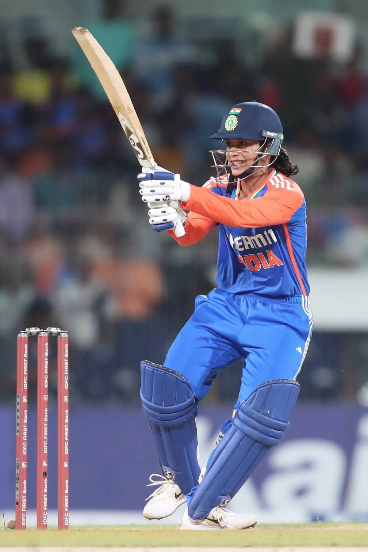 Smriti Mandhana batting during a competitive cricket game