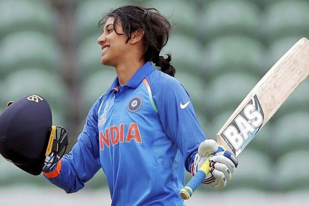 Smriti Mandhana batting during a cricket match with focus