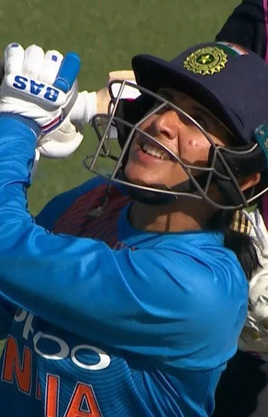 Smriti Mandhana Batting in Blue Jersey with Helmet wallpaper