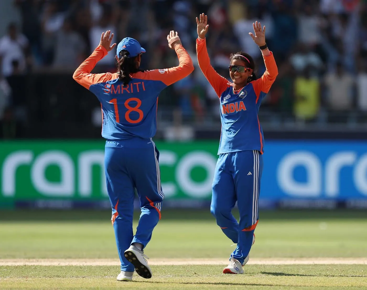 Smriti Mandhana celebrating a team victory on field