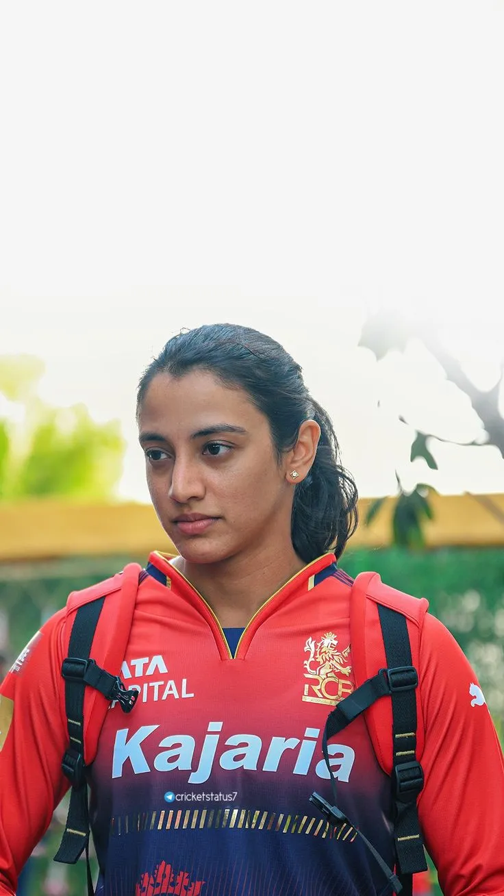 Smriti Mandhana cheering with her team during a cricket match