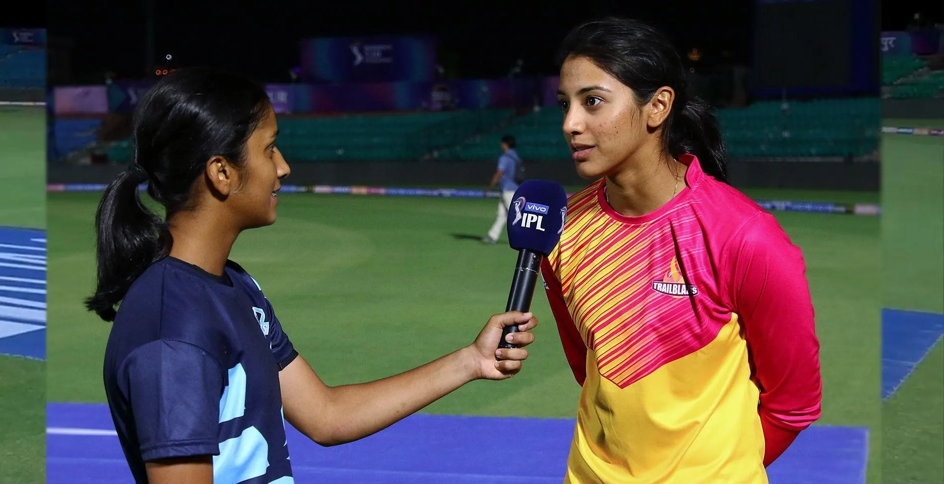 Smriti Mandhana collaborating with teammates for a win