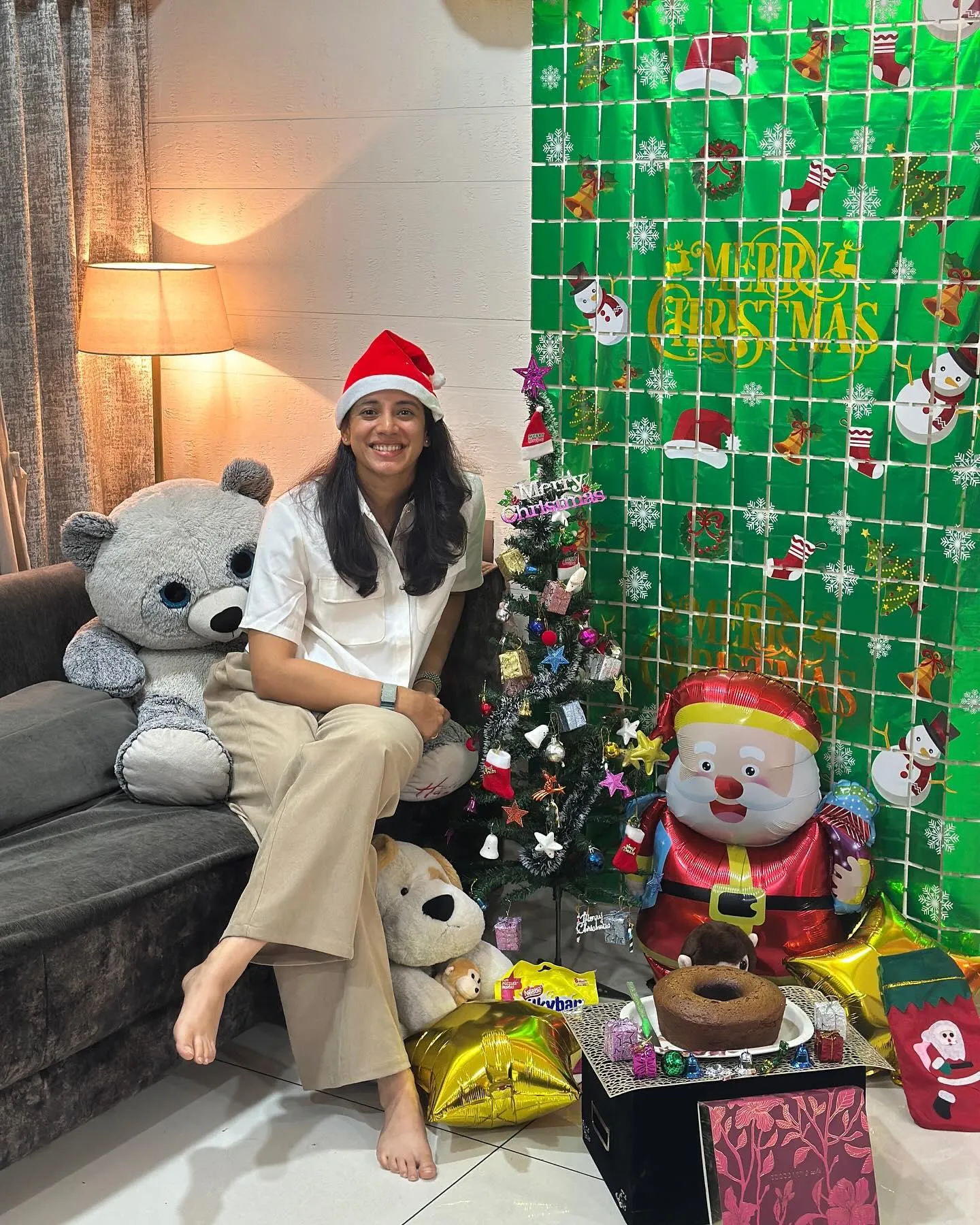 Smriti Mandhana decorating a Christmas tree with ornaments