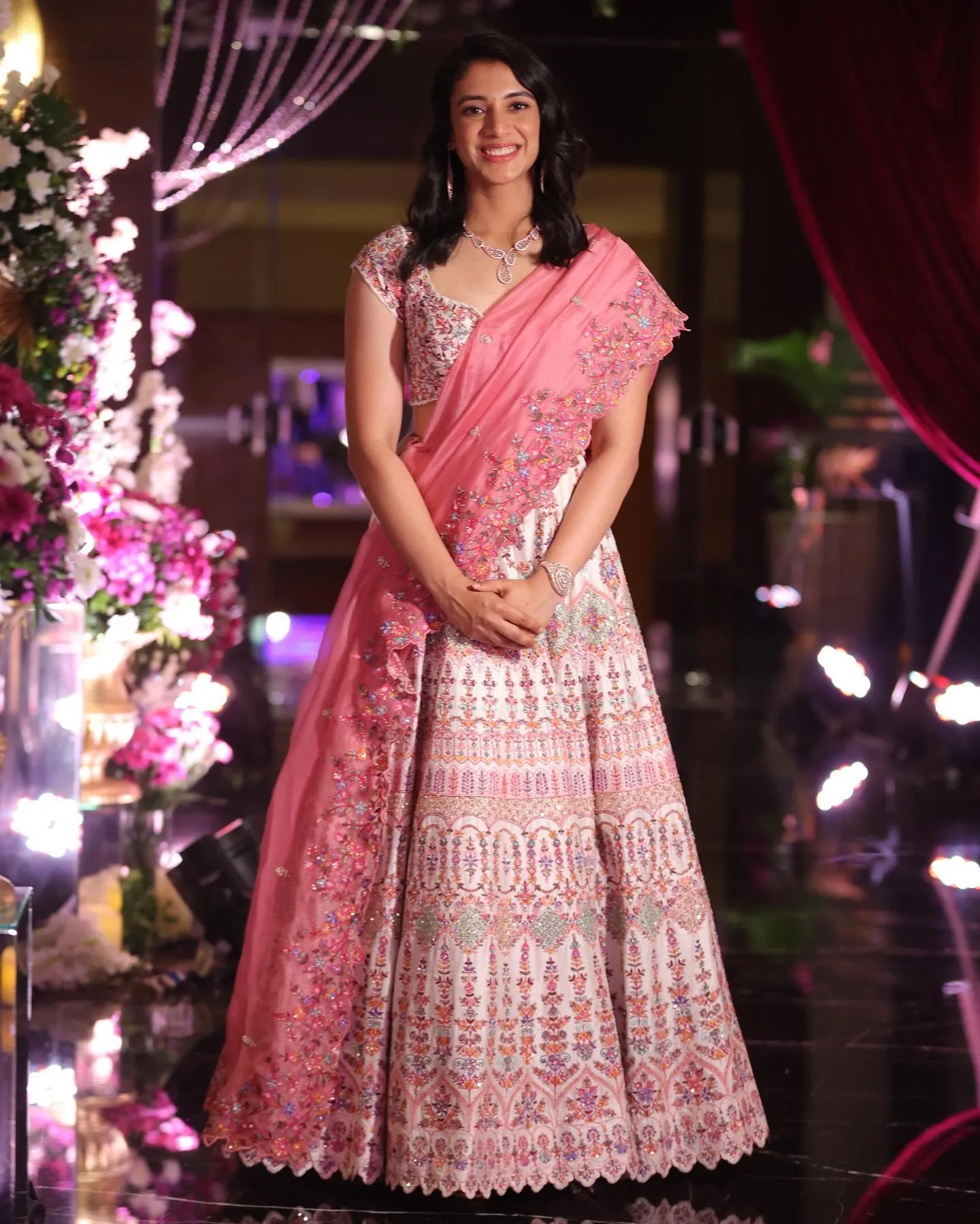 Smriti Mandhana dressed in a pink traditional gown at an event