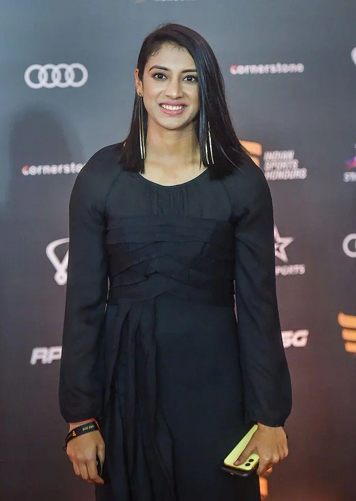 Smriti Mandhana Elegant Black Dress on Red Carpet wallpaper
