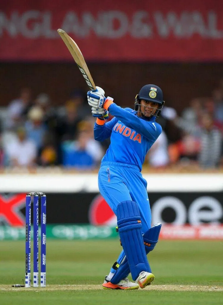 Smriti Mandhana Hitting a Shot in Blue India Kit wallpaper