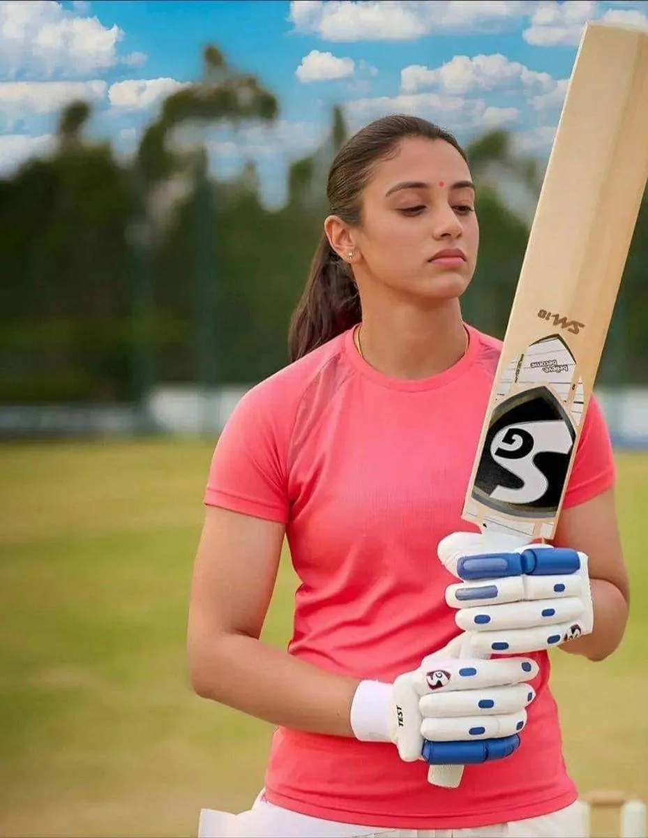 Smriti Mandhana holding a bat ready to play at the crease