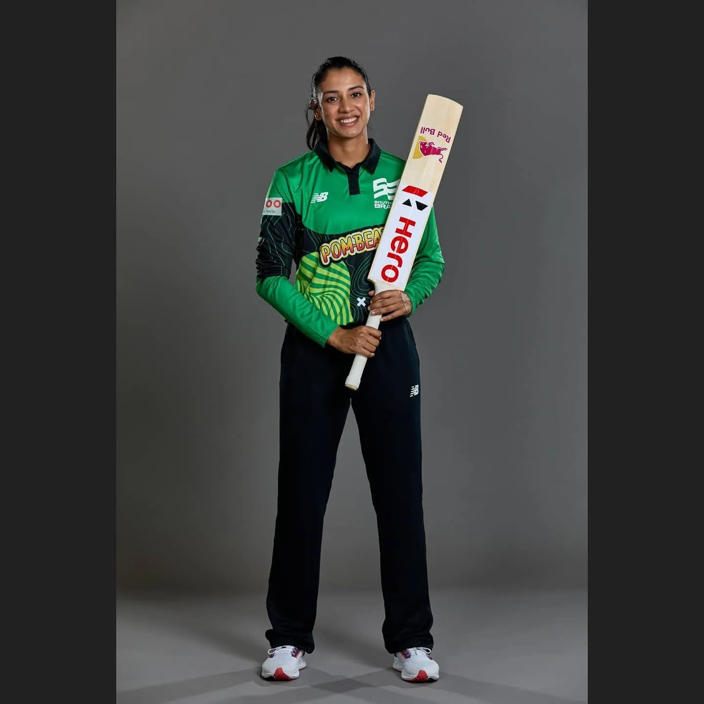 Smriti Mandhana Holding Bat in Studio Photoshoot Pose