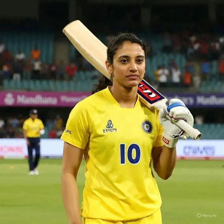 Smriti Mandhana Holding Bat in Yellow Jersey wallpaper