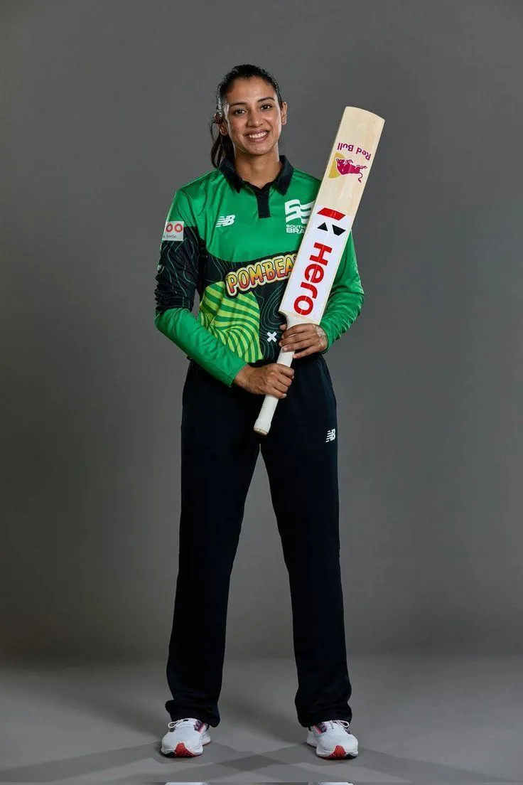 Smriti Mandhana Holding Cricket Bat in Green Jersey