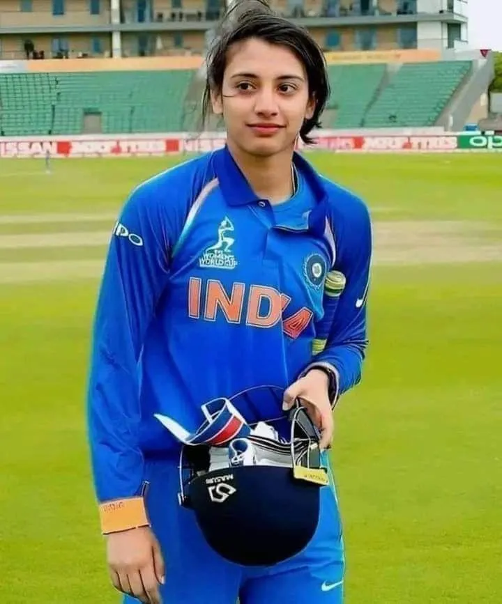 Smriti Mandhana Holding Cricket Gear with Left Hand