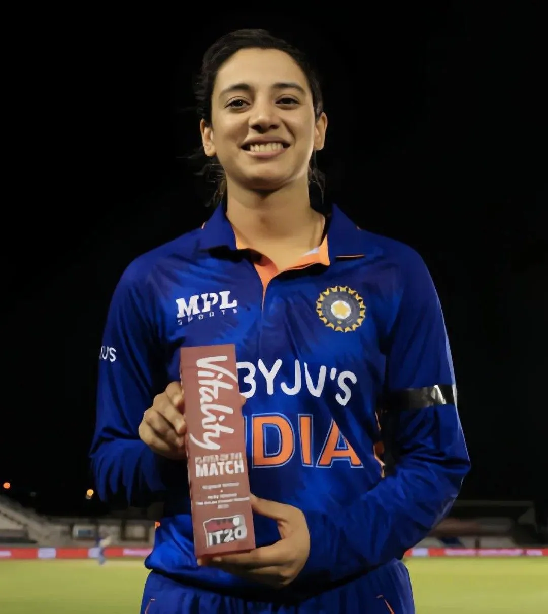 Smriti Mandhana Holding Trophy After a Victory wallpaper