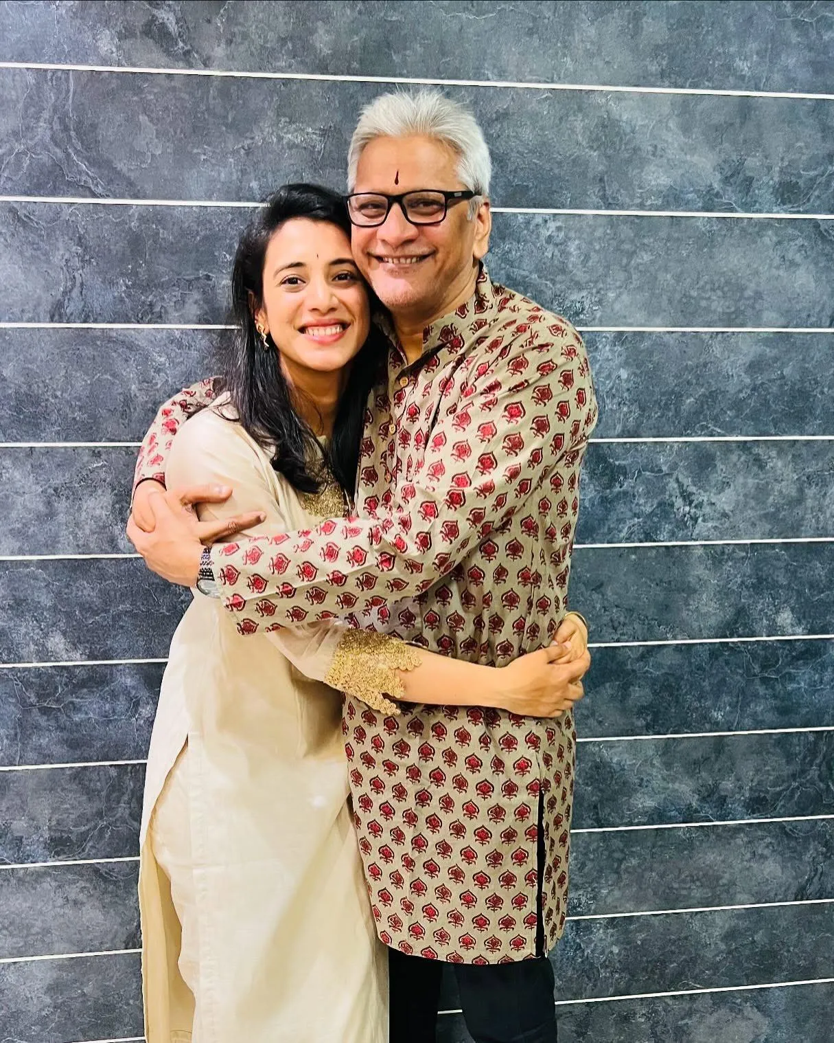 Smriti Mandhana hugging her friend and smiling warmly