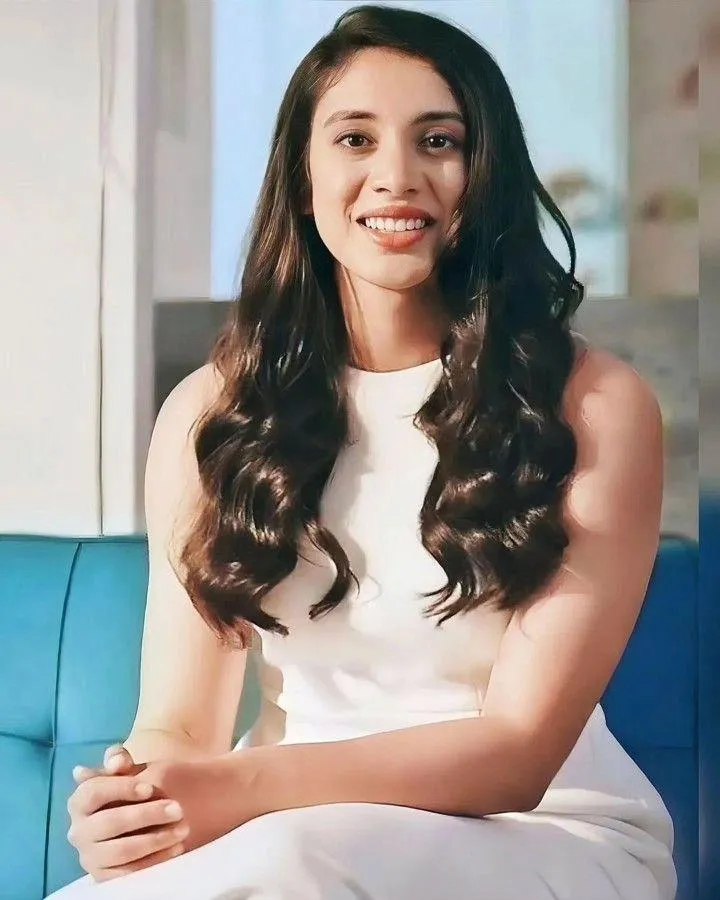Smriti Mandhana in a Formal Dress with Curls wallpaper